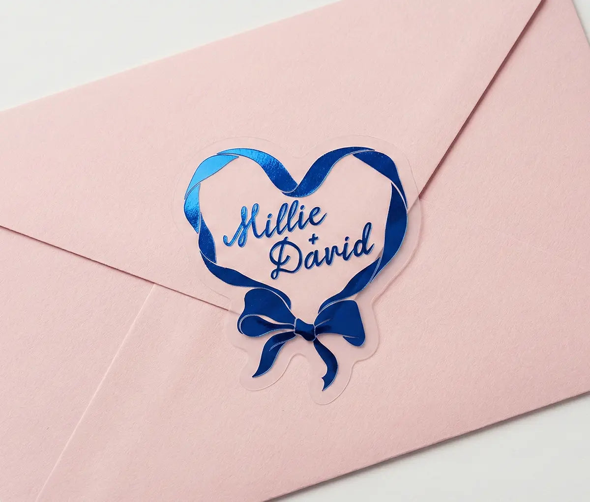 Ribbon in heart shape wedding labels printed in royal blue foil on transparent frosted vinyl