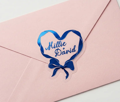 Ribbon in heart shape wedding labels printed in royal blue foil on transparent frosted vinyl
