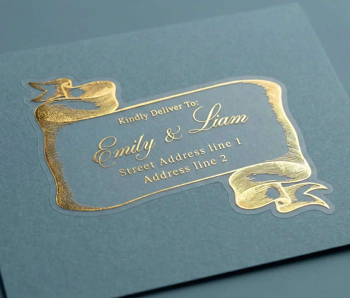 Custom Gold guest address label on a blue envelope with bespoke whimsical scroll design.