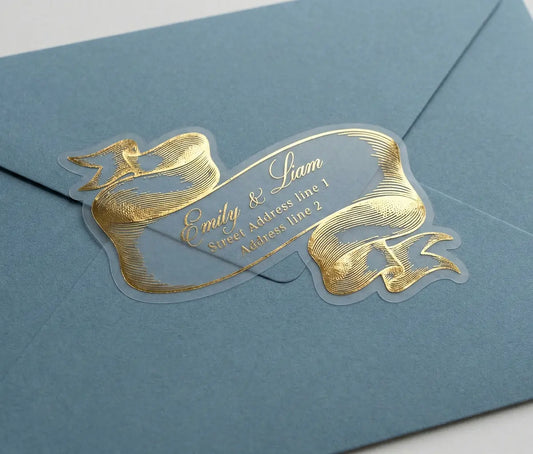 Gold foil printed romantic address label on a blue envelope