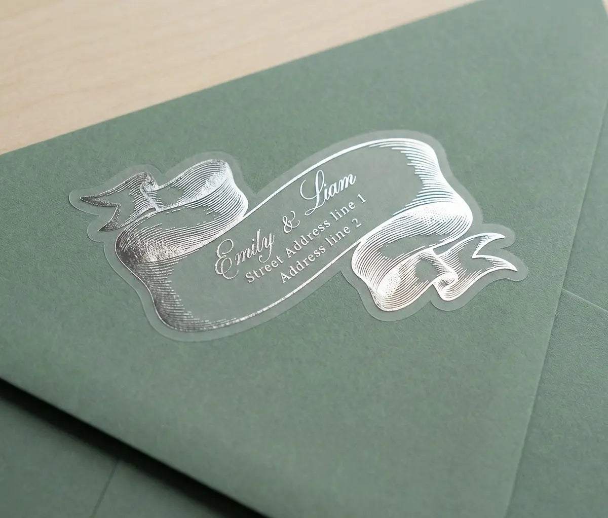 Green envelope with a vintage-inspired silver foil printed return address label.